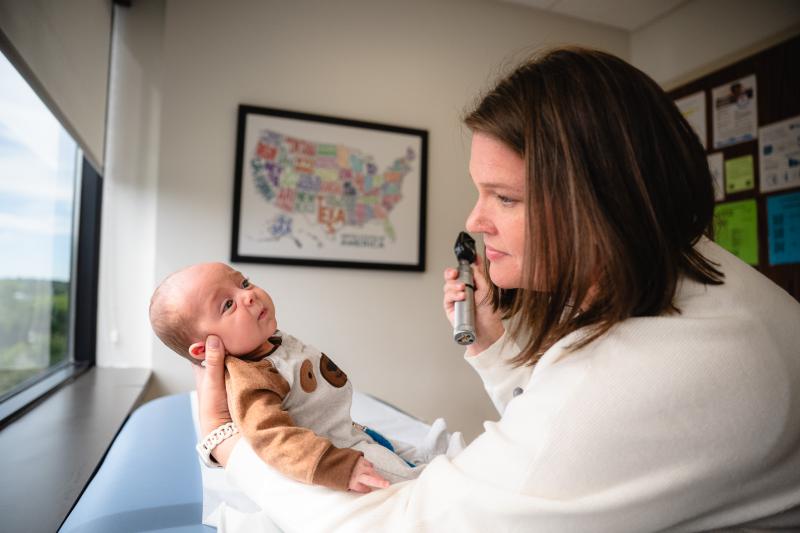 nurse practitioner with infant 